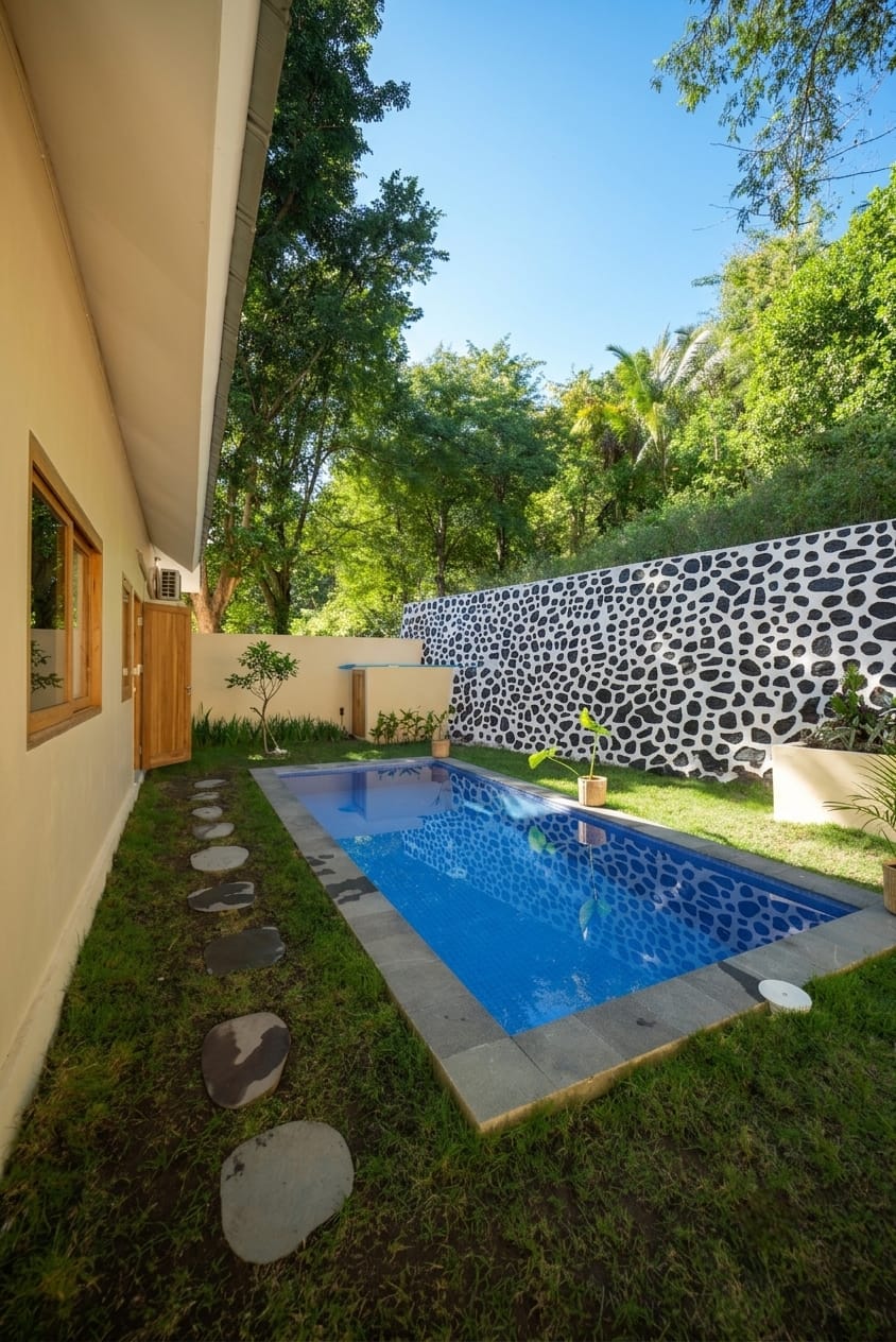 Private pool along the villa with stepping stones and lawn