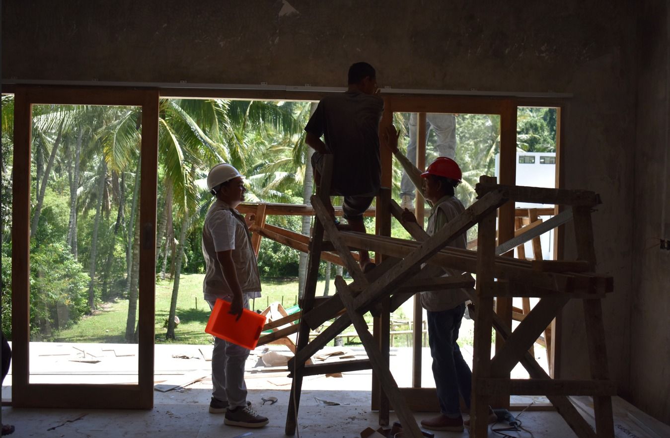 Custom-built window walls installed by the carpentry crew